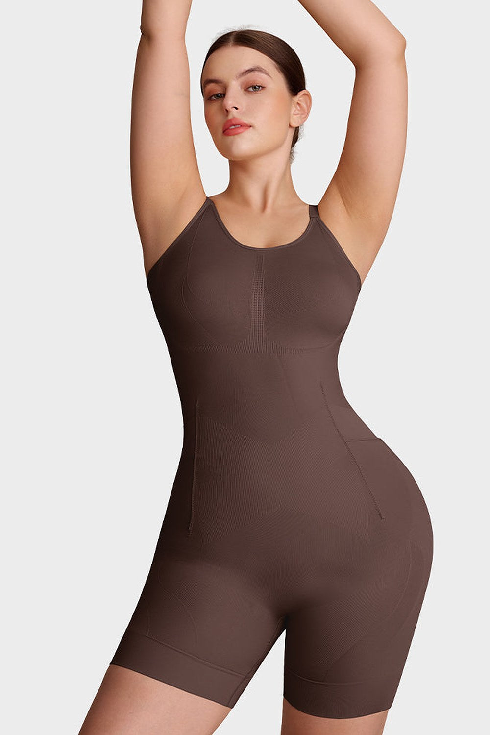 Nova Seamless Sculpting Bodysuit in Coffee Brown – front, arms raised