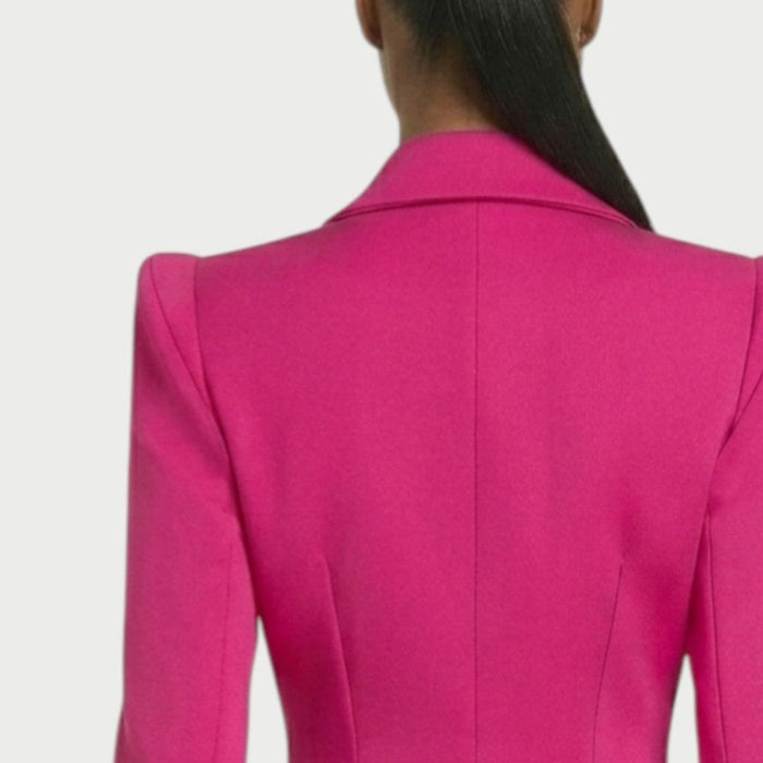 Padded shoulders on the Vesper blazer mini dress in Fuchsia
